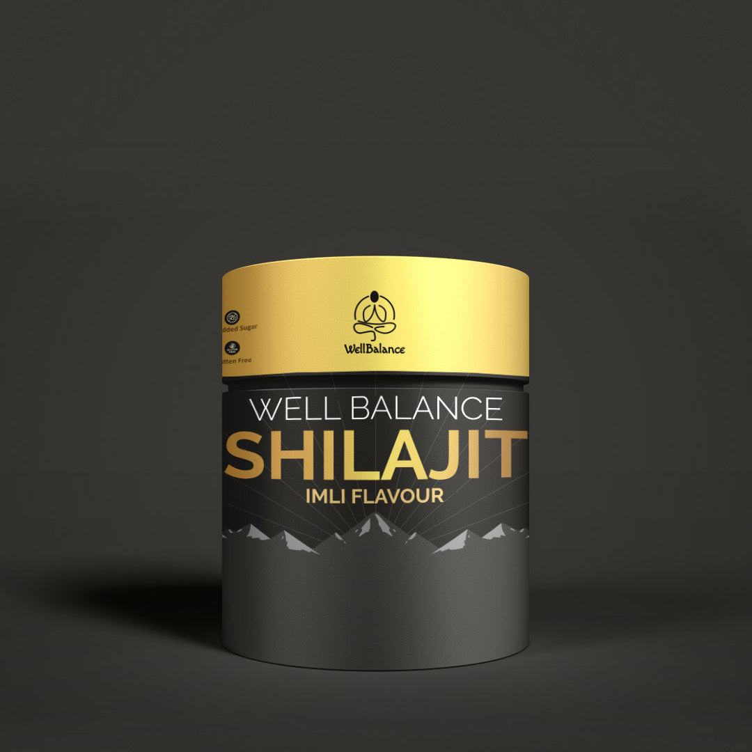 Well Balance Shilajit container with gold and black design on a dark background